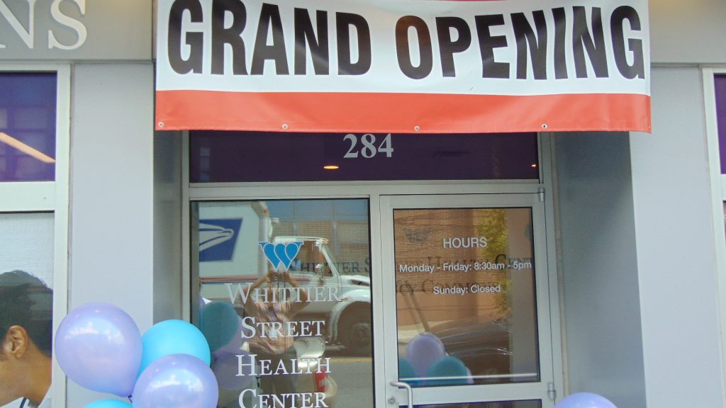 Quincy Common Grand Opening (Banner) Whittier Street Health Center